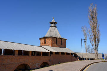 Watchtower and alley with a lantern and a poplar tree near the fortress wall of the ancient Nizhny Novgorod Kremlin
