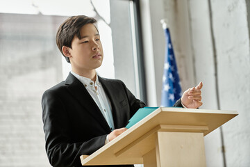 Teenage boy delivers a speech at a UN Model conference.