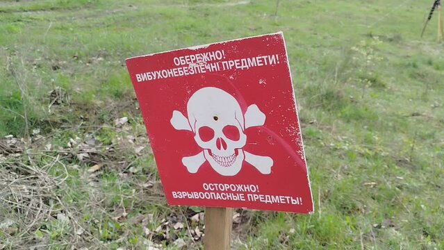 the sign Beware of Mines is installed on the minefield