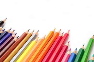 Selective focus, Top view of colored pencils or pastel on white background. Learning, study and presentation concept.