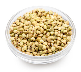 Glass bowl of raw buckwheat on white background. File contains clipping path.