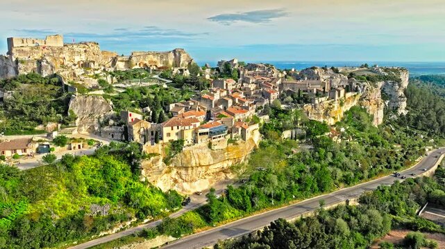 Aerial view of Medieval fortress ruins with replica siege engines in France. Les Baux de Provence village is on the rock formation, and its castle Ch&acirc;teau des Baux-de-Provence in France.