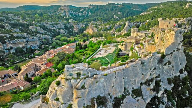 Aerial view of Medieval fortress ruins with replica siege engines in France. Les Baux de Provence village is on the rock formation, and its castle Ch&acirc;teau des Baux-de-Provence in France.