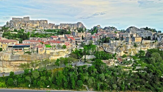 Aerial view of Medieval fortress ruins with replica siege engines in France. Les Baux de Provence village is on the rock formation, and its castle Ch&acirc;teau des Baux-de-Provence in France.