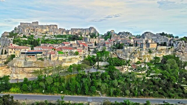 Aerial view of Medieval fortress ruins with replica siege engines in France. Les Baux de Provence village is on the rock formation, and its castle Ch&acirc;teau des Baux-de-Provence in France.