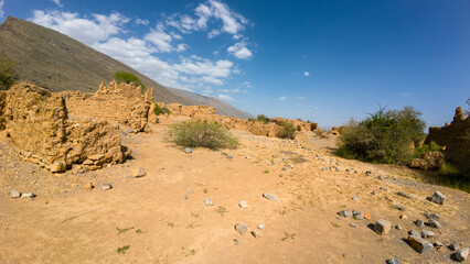 Photography of old abandoned and decayed in Oman mountainous desert during spring day