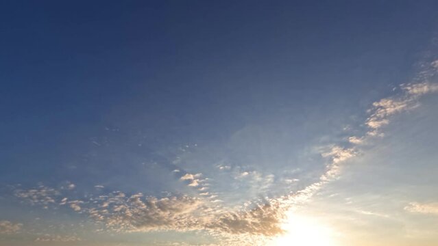 timelapse clip of pretty fluffy clouds at sunrise for forecast