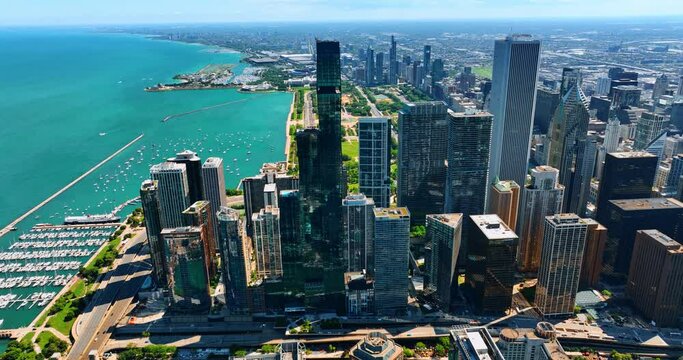 Breath-taking scenery of the waterfront of Lake Michigan in Chicago, Illinois, the USA. Sunny day footage above the gorgeous metropolis and waterscape.