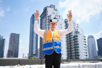 Engineer or worker wearing virtual reality glasses(VR) at urban industrial site