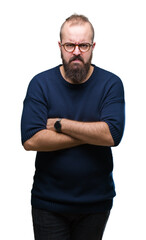 Young caucasian hipster man wearing sunglasses over isolated background skeptic and nervous, disapproving expression on face with crossed arms. Negative person.