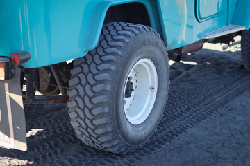 car wheels designed for off-road conditions, such as desert terrains, ideal for automotive and adventure themes