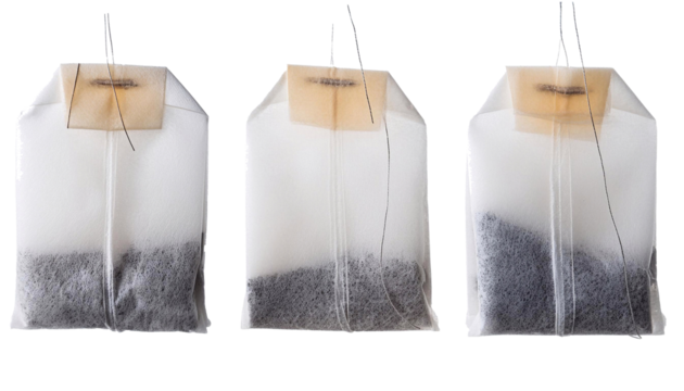 Collection of three tea bags with varying saturation isolated on a transparent checkered backdrop