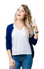 Fototapeta premium Beautiful young blonde woman over isolated background pointing finger up with successful idea. Exited and happy. Number one.