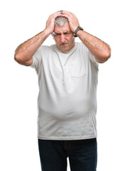 Fototapeta premium Handsome senior man over isolated background suffering from headache desperate and stressed because pain and migraine. Hands on head.