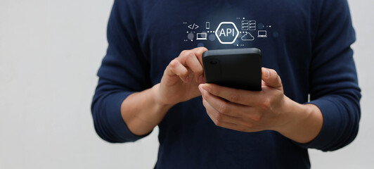 close up programmer man hand use smartphone and show processing and procedure of API software programming to synchronize and transfer data from database to website for technology business concept