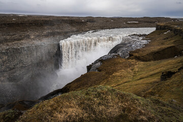 Fototapeta premium Dettifoss waterfall on iceland under a dramatic sky in summer