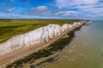The drone aerial view of Seven Sisters On the South coast of England. The Seven Sisters are a series of chalk sea cliffs on the English Channel coast. 
