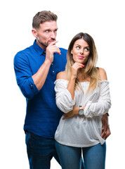 Young couple in love over isolated background with hand on chin thinking about question, pensive expression. Smiling with thoughtful face. Doubt concept.