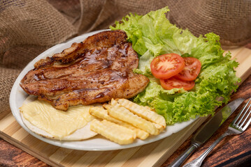 Colombian dish similar to the tray paisa with meat, beans, rice, salad, potato salad