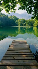 Beautiful Lake with Greenery, Mountains, and Sunlight

