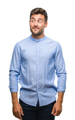 Young handsome man over isolated background smiling looking side and staring away thinking.