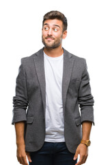 Fototapeta premium Young handsome business man over isolated background smiling looking side and staring away thinking.