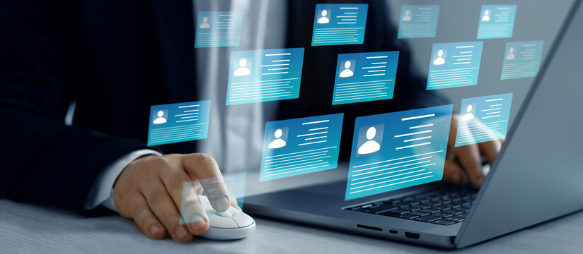 Human resource manager checks  CV online to choose perfect employee for his business work. Online technology for simplifying human resources system management.
