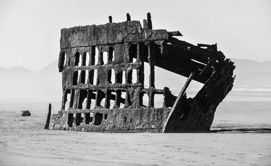 Fotobehang Schipbreuk wreck on the beach  © J. Lee