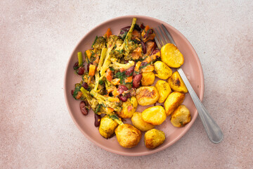 Stewed potatoes with stewed vegetables, broccoli and beans with carrots and herbs, a delicious hearty lunch or dinner