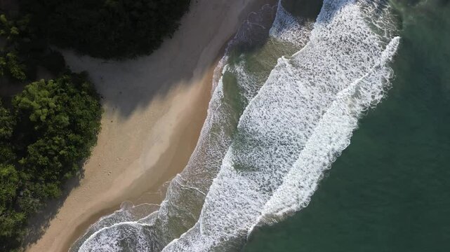 Waves crashing on the paradisiacal beach