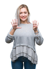 Young blonde woman over isolated background showing and pointing up with fingers number nine while...