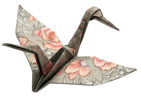 A detailed origami crane with floral patterns, symbolizing peace, hope, and good luck.
