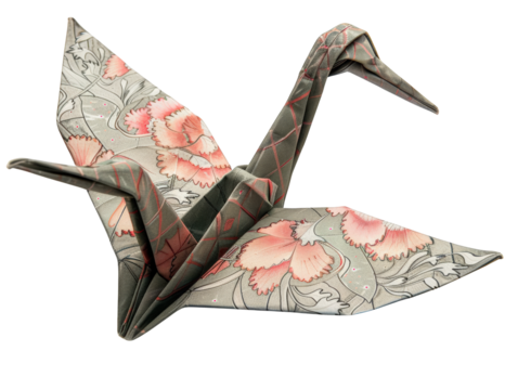 A detailed origami crane with floral patterns, symbolizing peace, hope, and good luck.