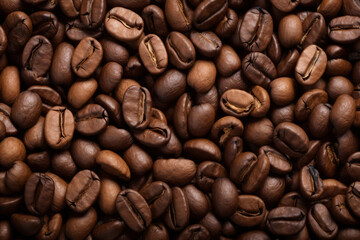 Fototapeta premium Processed collage of dark brown coffee beans texture. Background for banner, backdrop or texture