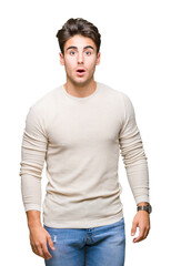 Fototapeta premium Young handsome man over isolated background afraid and shocked with surprise expression, fear and excited face.