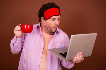 Early morning fresh gossip. Funny fat man drinking coffee. Brown background.