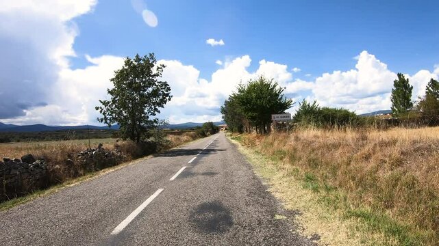 French Way of Saint James - a paved road entering El Ganso village, municipality of Brazuelo, region of Maragateria, province of Leon, Castile and Leon, Spain