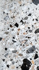 Close up of decorative quartz sand epoxy coated floor or wall coating with grey, black and white coloured particles. Copy space