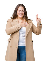 Beautiful plus size young woman wearing winter coat over isolated background Swearing with hand on...