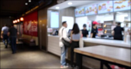 Time Lapse video of People Walking and Ordering from a Fast Food restaurant. Blurred background 4K video.