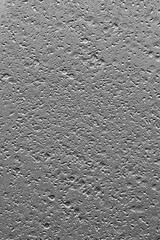 Pebble beach black and white. Shiny bright gray background. 