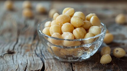Glass bowl filled with healthy macadamia nuts