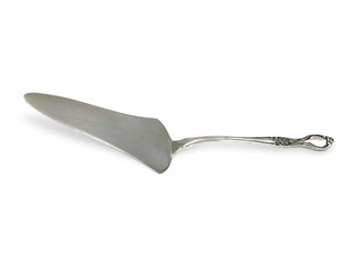 Photo of an elegant stainless steel cake server, isolated on white background.
