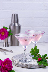 Pink martini cocktail with rose syrup