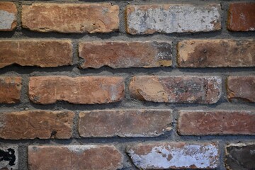 old brick wall with recycled brick masonry construction