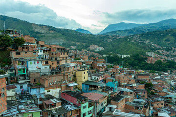 Fototapeta premium Medellin, Medellín, Antioquia, Colombia : Panoramic view of the Comuna 13 district. Clouds.