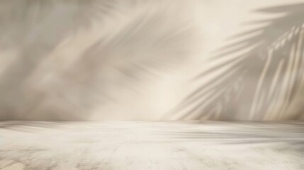 Obraz premium Soft, abstract shadows of palm leaves on a light-colored, textured background. Perfect for a tropical, natural, or calming themed design backdrop.