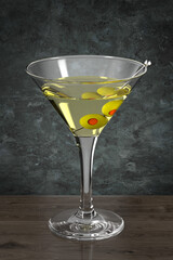 Glass with cocktail on the wooden table against the wall in the grunge style. Bar theme. Drink with olives. Dark environment. 3d rendering.