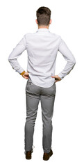 Young handsome business man standing backwards looking away with arms on body