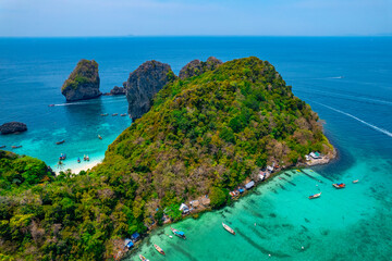 Fototapeta premium Aerial drone photo Turquoise lagoon with white coral sand Nui beach. Landscape koh Phi Phi Don island, Krabi, Thailand.